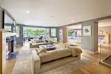 The epitome of open concept living has been achieved by this New York City townhome. Two large NanaWall opening glass wall units open up both the living room and dining room areas to an outdoor balcony allowing both fresh air and natural light to overtake the space.