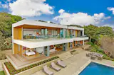 This California home offers a prime example of indoor/outdoor living. Every room is equipped with a NanaWall system that offers endless views of the bay. 