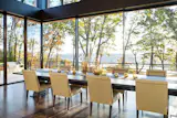 Canopies of trees and mountain views surround this West Virginia contemporary home. NanaWall minimal sliding glass walls open the space to the outdoors while allowing natural light to filter into the home creating the ultimate serene home for recreation and tranquil dinners.