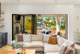 Contemporary living room with NanaWall folding glass doors