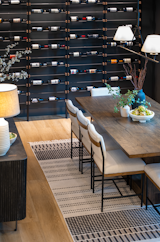 Contemporary dining room with wine storage wall