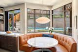 Another V-shaped popout in the breakfast nook complements a bi-fold pass-through window in the kitchen.