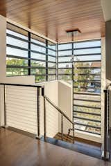 An eye-catching stack of Western Window Systems fixed windows surrounds the front stairwell.