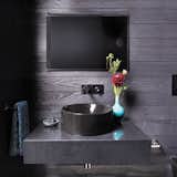 All black powder room with Cambria Black and Kohler Vox sink