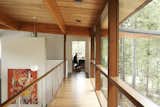 Hallway and Medium Hardwood Floor  Photo 3 of 5 in Grange Lake House by Turkel Design