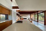 Great room with kitchen, living area, and patio