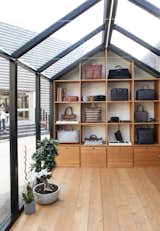 The structure features custom millwork to display the brand's bags and accessories. &nbsp;