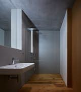 Bath Room, Medium Hardwood Floor, Wall Mount Sink, Enclosed Shower, Ceramic Tile Floor, and Ceramic Tile Wall  Photos from Weekend House in Beskydy