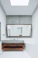 Bath Room, Concrete Counter, Concrete Wall, and Ceiling Lighting  Photo 17 of 31 in Villa Sophia by BoysPlayNice Photography & Concept