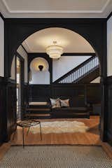 Hallway and Medium Hardwood Floor Re-energized finishes combine with modern touches to redefine the feel of this charming Victorian house.  Photo 2 of 5 in Modern Victorian by Walker Architects