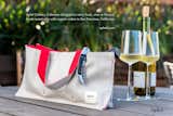 HORIZONTAL WINE TOTE
Horizontal wine tote carries one bottle with three side pockets for small food items and accessories. Makes the perfect gift or casual picnic.