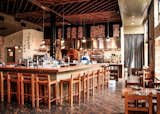 The Red Hen DC is located in the up and coming neighborhood of Bloomingdale, Washington DC. Poritz & Studio produced the custom floors, ceiling, tables, chairs, bar stools and benches of the restaurant. All of the items are made entirely of hurricane Felix felled old growth tropical lumber. Each chair weighs in at over 25 pounds; the pieces are made to last and take the repeated abuse a high traffic restaurant requires.
