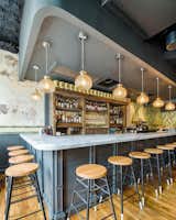 All Purpose is located in the neighborhood of Shaw in Washington DC. Using air dried Pine selectively cut from Massachusetts, Poritz and Studio fabricated the tables, banquets, booths, millwork and back bar for the restaurant. Custom stains were used on the table tops to match the interior paint finishes.   
