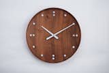 FJ Clock - TIMELESS AND STREAMLINED

The FJ Clock was designed as a part of the interior of the New York United Nation Trusteeship Council Chamber in 1950 and it captures the essence of Juhl’s design aesthetic. The circular shape complementing the natural qualities of the teak wood and the numberless aluminum dial captures his flair for clever minimalism.

