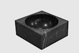 PK-600 - A TIMELESS WORK OF ART 

A big brother to the PK-Bowl, the PK-600 is a sculptural piece in luxurious black Nero Marquina marble of which only 10 are produced per year. Originally designed by Poul Kjærholm as an oversized ashtray for the town hall of Frederica in 1963, today it is produced according to the original drawings by the architect. Its smooth semi-spherical inner black marble surface softly reflects incoming light, making it as sculptural as it is functional.