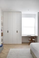 Bedroom, Recessed Lighting, Chair, Storage, Bed, Ceiling Lighting, Light Hardwood Floor, Wardrobe, and Bookcase Primary bedroom Detail  Photo 18 of 27 in The Oak Thread by Space4Architecture