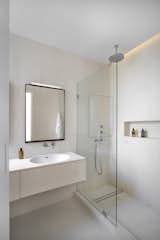 Bath Room, Stone Counter, Stone Tile Wall, Accent Lighting, Drop In Sink, Recessed Lighting, Limestone Floor, Open Shower, Ceiling Lighting, and Full Shower Primary Bathroom  Photo 20 of 27 in The Oak Thread by Space4Architecture