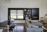 Living Room, Bench, Gas Burning Fireplace, Medium Hardwood Floor, Sofa, Bookcase, Pendant Lighting, Coffee Tables, Chair, and Sectional Custom Window Seat + Shelving + Fireplace  Photo 7 of 9 in Modern Lodge by KEM STUDIO