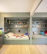 Bedroom, Bed, Ceiling Lighting, Storage, Light Hardwood Floor, and Shelves  Photo 17 of 21 in AUGUST  |  Triplex in the Collserola hills of Barcelona by Nook Architects