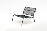 The 'Carbon Frog' armchair by Living Divani. With a carbon fibre frame and a nylon woven seat, it's remarkably light.