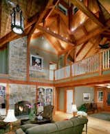 The Beautiful Timber Frame Cupola Lets Natural Light Pour in to this Cathedral Living Room  Photo 9 of 17 in Yellow Brook Farm House by Timberpeg