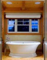 Deep Soaking Tub in the Master Bathroom  Photo 17 of 17 in Yellow Brook Farm House by Timberpeg