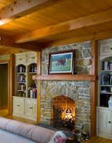 A Cozy Fireplace Adds a Bit of Intimacy to this Master Bedroom Suite