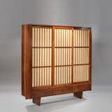 The only armoire known to have been made by George Nakashima. It was custom designed and fitted as an armoire with sliding grilled pandanus cloth doors, dovetailed edges and drawers. The interior is fitted for hanging clothing. Made in 1967.  Photo: Moderne Gallery.