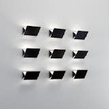 CHARLOTTE PERRIAND
Set of nine wall lights, model no. CP1, 1960s.  Photo: Phillips.