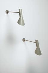 ARNE JACOBSEN
AJ Wall Sconce, rare long arm version, manufactured by Louis Poulsen, c. 1957.  Photo: Phillips.
