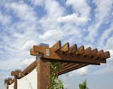 The pergola was fabricated from solid Ipe and is assembled using stainless steel bolts and plates.