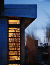 At night the penthouse addition shines with a warm glow.  Photo 7 of 9 in East Village Penthouse & Roof Garden by pulltab