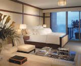 Master Bedroom with paneled walls in leather and Purple heart wood.