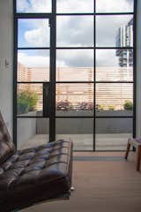 The top-floor pavilion accommodates a bedroom, living space and a bathroom inside a timber-clad volume.