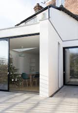 The materials and forms of the new architecture address and reconcile the eclectic building language of the existing buildings to the site.