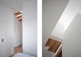 Concealed detailing lends the staircase the appearance of its depiction as arrayed planes in the axonometric drawing.