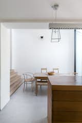 Moving through the house, one looks through layers of frameless openings in the interior and exterior walls and roofs.