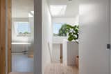 Within a traditional mansard roof form, a new top-floor continues the visual strategy of the ground floor, both in material palette and in the articulation of doors and windows as incisions.