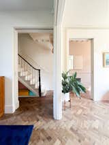 
Concealed fire doors make the minimally altered ground floor feel more open-plan, while new frameless glazing to the rear elevation creates an art-like framed view of the garden.