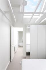 On the first floor, the ceiling structure is exposed to increase the volume of space, and rooflights and mirrors elongate views, actually and virtually respectively