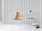 Chair: Trua 65270 4-leg armchair with Oak shell, frame in Chrome.

Side Table: Cahoots 9081 Small round table, top in Champagne, base in Chrome.