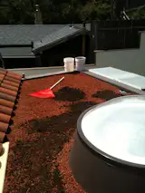 After the layer of fabric, pour a layer of lava rock. After the lava rock a layer of mushroom mulch.