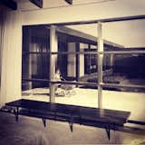 A custom Smilow-Thielle walnut bench in a 1950's Southern California home. #midcentury #classic #smilow