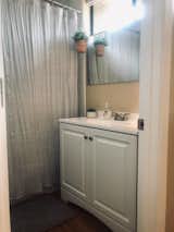 Bath Room, Laminate Counter, Drop In Sink, Alcove Tub, and Vinyl Floor  Photo 12 of 27 in Nakomis Dwellings by Jake Skinner
