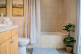 Bath Room, Ceramic Tile Wall, Alcove Tub, Open Shower, Soaking Tub, Two Piece Toilet, Ceiling Lighting, Tile Counter, and Concrete Floor  Photo 8 of 22 in Marquette Modern by Jake Skinner