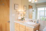 Bath Room, Ceiling Lighting, Concrete Floor, Soaking Tub, Drop In Sink, Alcove Tub, Ceramic Tile Wall, Tile Counter, and Two Piece Toilet  Photo 7 of 22 in Marquette Modern by Jake Skinner