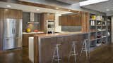 Kitchen, Refrigerator, Wood Cabinet, Range Hood, Cooktops, Medium Hardwood Floor, Recessed Lighting, Ceiling Lighting, and Wall Oven  Photo 1 of 4 in Ribbon Kitchen by FORWARD Design | Architecture