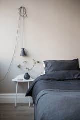 Hang a silicone "Bollard" plug-in lamp from Menu, Denmark, on a cup hook.  Or any small pendant lamp with plug.  Or any hook.