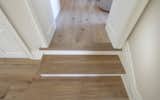 Main Line Residence featuring reSAWN TIMBER co.'s BASTILLE European White Oak flooring  and nosings