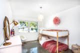 Bedroom, Bunks, Storage, Pendant Lighting, Accent Lighting, and Concrete Floor  Photo 14 of 30 in - : - MidCentury Ranch in Dover Shores    -  :  -     for sale :  4 bed | 3 bath | 2032 sq' |  large lot with a pool by bouHAUS properties